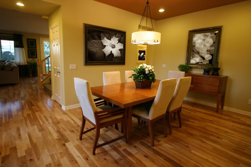 A Pearland dining rooms with floors refinished by Fabulous Floors.