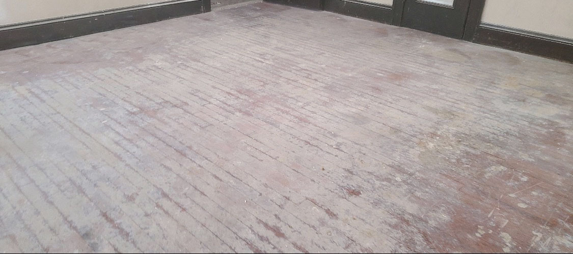 A hardwood floor in need of some restoration
